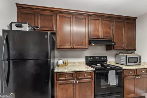 Kitchen - 152 Mathews Rd, Milner, GA 30257 photo 4 of 4