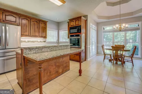 Kitchen - 353 Crowell Rd N, Covington, GA 30014 photo 5 of 9