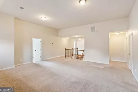 Living - 457 Mossycup Dr, Fairburn, GA 30213 photo 3 of 3