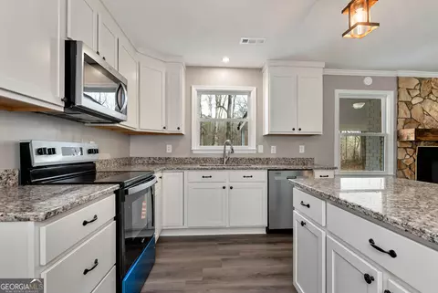 Kitchen - 587 Forest Ln, Colbert, GA 30628 photo 2 of 2