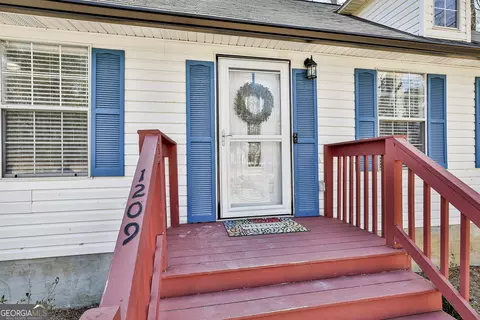 Exterior - 1209 N Hampton Dr, Hampton, GA 30228 photo 5 of 14