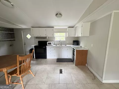 Kitchen - 877 W Rushing Rd, Register, GA 30452 photo 2 of 2