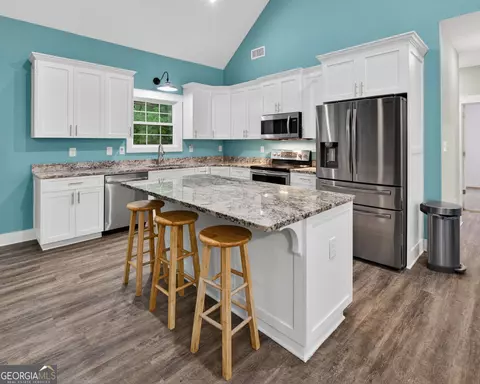 Kitchen - 227 Mckenzie Rd, Milner, GA 30257 photo 3 of 3
