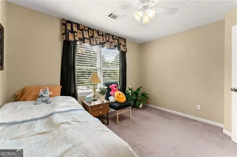 Bedroom - 4795 Winding Rose Dr, Suwanee, GA 30024 photo 2 of 7