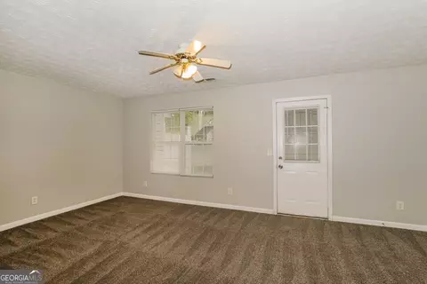 Living - 11418 Ashefield Ln, Hampton, GA 30228 photo 2 of 3