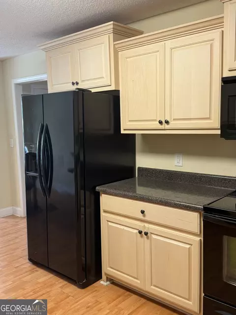 Kitchen - 105 Nealys Way, Haddock, GA 31033 photo 1 of 3