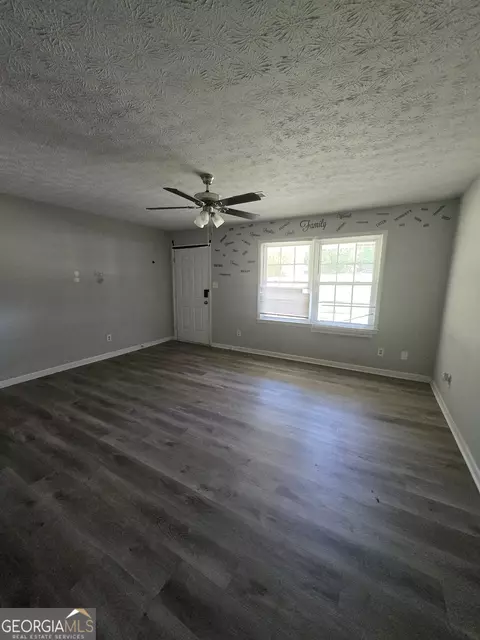 Living - 12130 Brown Bridge Rd, Covington, GA 30016 photo 2 of 2