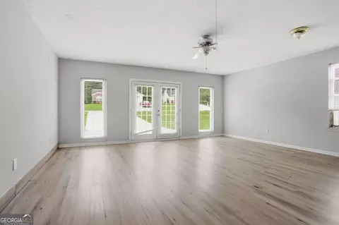 Living - 11190 Knotty Pine Pl, Hampton, GA 30228 photo 5 of 6