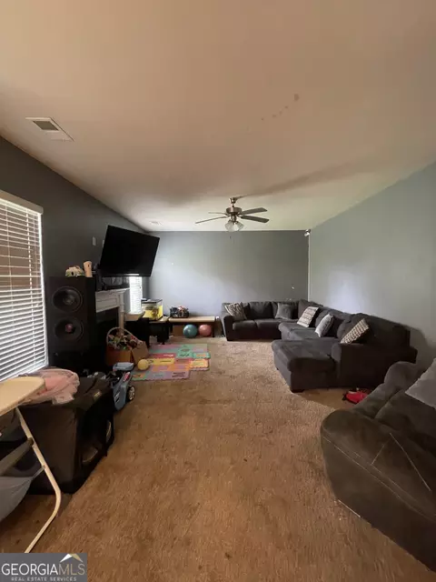 Living - 12173 Centerra Dr, Hampton, GA 30228 photo 5 of 5