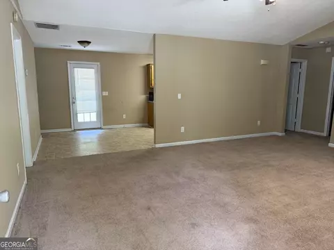 Living - 1220 N Hampton Dr, Hampton, GA 30228 photo 4 of 5
