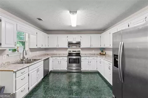 Kitchen - 245 Cypress Dr, Covington, GA 30016 photo 3 of 3
