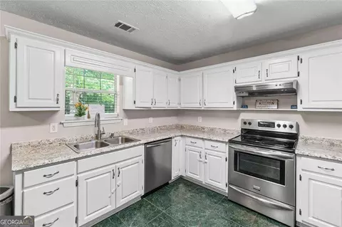 Kitchen - 245 Cypress Dr, Covington, GA 30016 photo 2 of 3