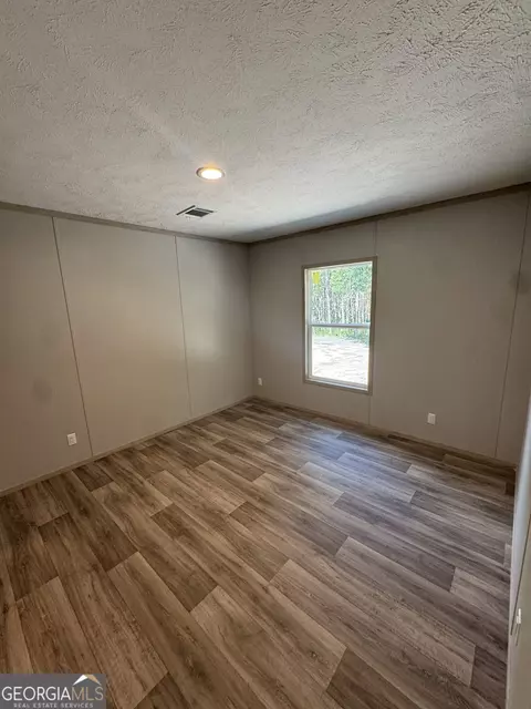 Bedroom - 38 Jane St, Midway, GA 31320 photo 2 of 8