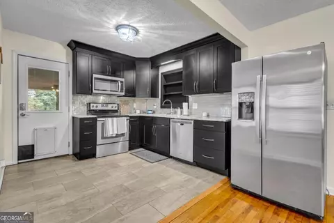 Kitchen - 130 Sharp St, Bremen, GA 30110 photo 2 of 3