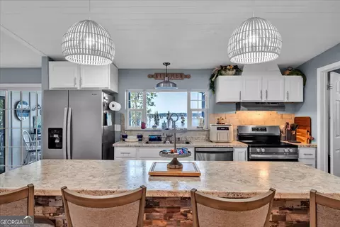 Kitchen - 121 W Entrekin Rd, Cobb, GA 31735 photo 3 of 4