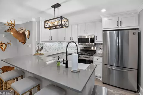 Kitchen - 109 Forest Pointe Dr, Forsyth, GA 31029 photo 9 of 10