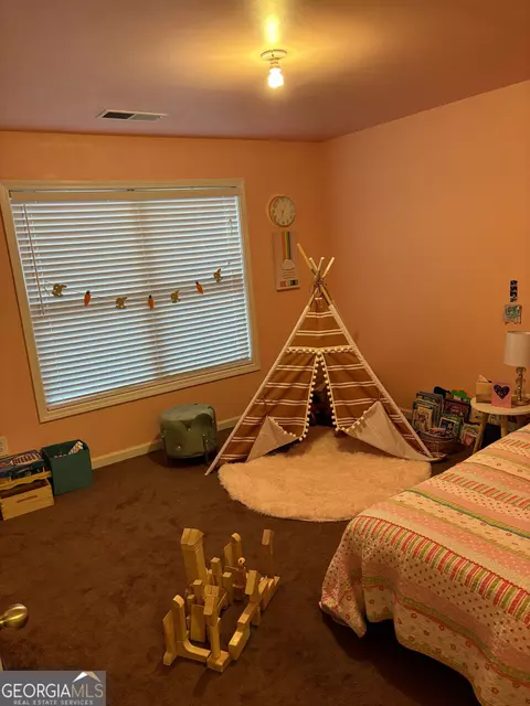 Bedroom - 16 Plum Blossom Ln, Hampton, GA 30228 photo 5 of 6
