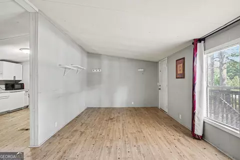 Living - 915 Steele Dr, Hampton, GA 30228 photo 3 of 4