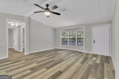 Living - 460 Etheridge Mill Rd, Milner, GA 30257 photo 4 of 5