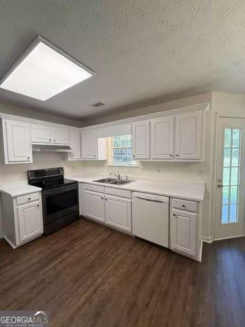 Kitchen - 255 Lakeside Dr, Covington, GA 30016 photo 2 of 2