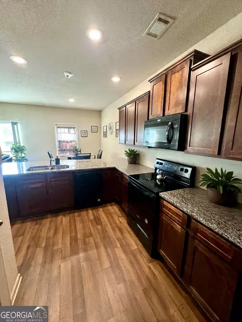Kitchen - 10783 Wheeler Trce, Hampton, GA 30228 photo 2 of 2