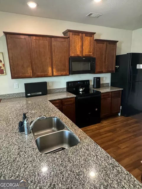Kitchen - 10783 Wheeler Trce, Hampton, GA 30228 photo 1 of 2