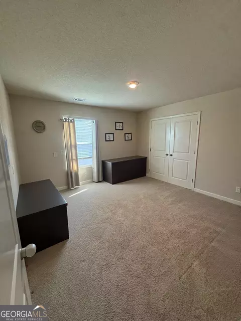Bedroom - 10783 Wheeler Trce, Hampton, GA 30228 photo 6 of 6