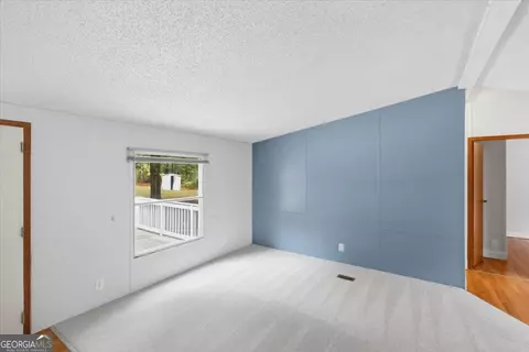 Living - 312 Blounts Chapel Rd, Haddock, GA 31033 photo 2 of 3