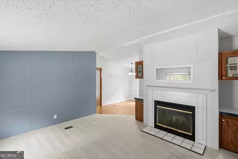 Living - 312 Blounts Chapel Rd, Haddock, GA 31033 photo 1 of 3