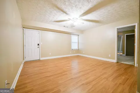 Living - 101 Bridgemill Dr, Hampton, GA 30228 photo 5 of 7