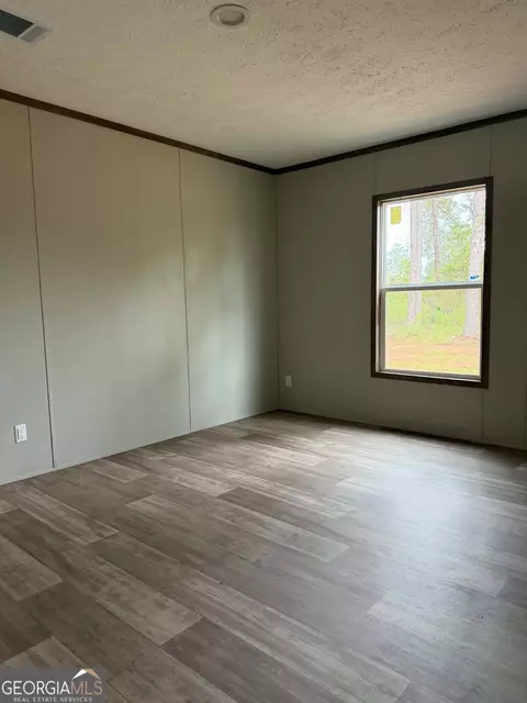 Bedroom - 1509 E 4th St Ext, Alma, GA 31510 photo 1 of 1