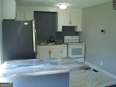 Kitchen - 1703 E 3rd Ct, Lanett, AL 36863 photo 2 of 7