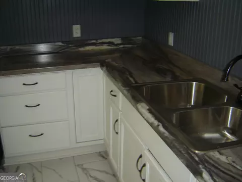 Kitchen - 1703 E 3rd Ct, Lanett, AL 36863 photo 5 of 7