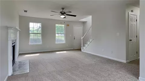 Living - 64 Dogwood Rdg, Hampton, GA 30228 photo 3 of 4
