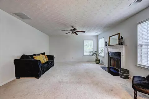 Living - 347 Cobblestone Ct, Hampton, GA 30228 photo 6 of 7