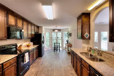 Kitchen - 340 Thoroughbred Trl, Monroe, GA 30655 photo 3 of 4