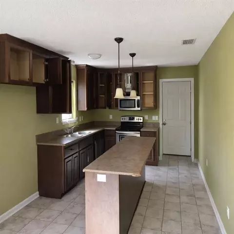 Kitchen - 141 Mcrae St, Atmore, AL 36502 photo 1 of 2