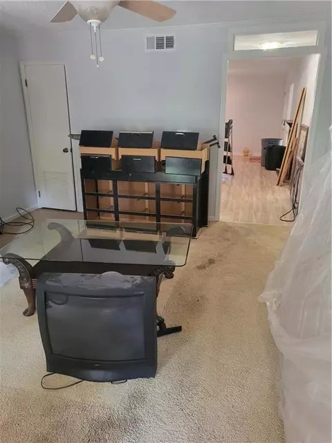 Living - 1102 Pine Tree Dr #1102, Buford, GA 30518 photo 3 of 4