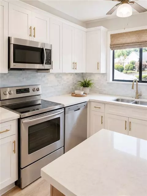 Kitchen - 1102 Pine Tree Dr #1102, Buford, GA 30518 photo 3 of 3