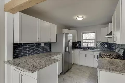 Kitchen - 300 Forest St, Buford, GA 30518 photo 2 of 3