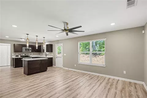 Living - 1128 Oak Hollow Ln, Hampton, GA 30228 photo 2 of 4