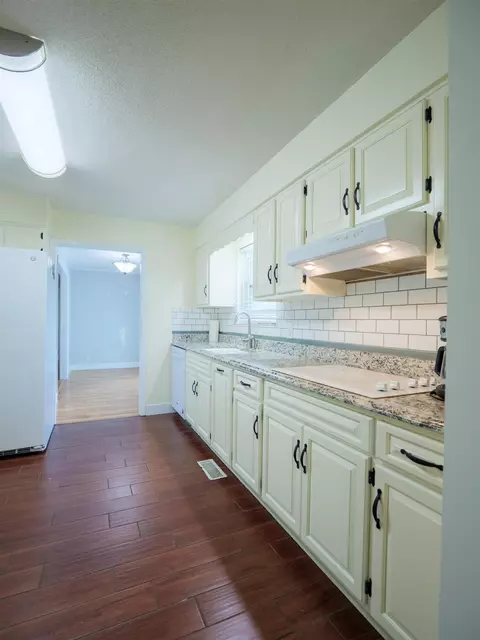 Kitchen - 405 NW Whispering Pines Loop, Madison, FL 32340 photo 3 of 6