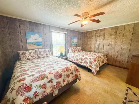 Bedroom - 1219 Alligator Dr, Alligator Point, FL 32346 photo 3 of 13