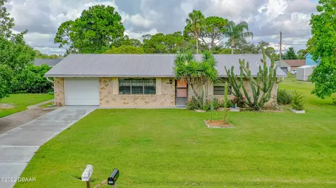 3038 Pine Tree Dr, Edgewater, FL 32141 photo 1