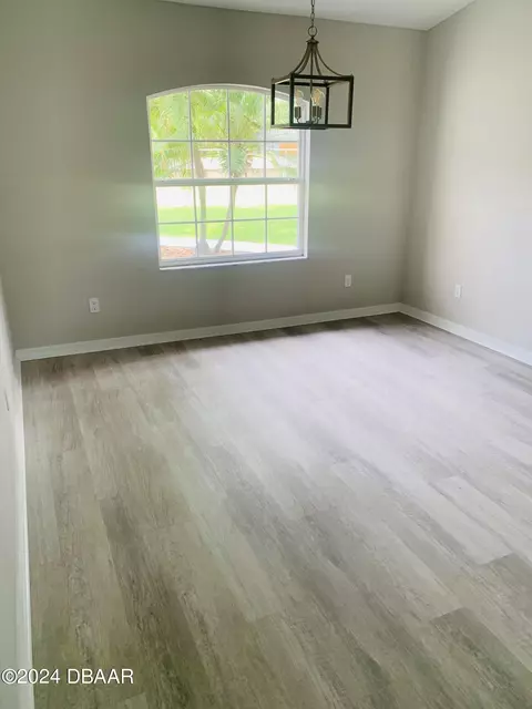 Living - 1828 Pine Tree Dr, Edgewater, FL 32132 photo 1 of 2