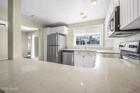Kitchen - 2120 Queen Palm Dr, Edgewater, FL 32141 photo 2 of 3