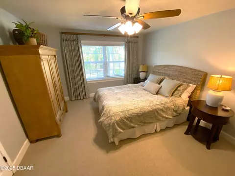 Bedroom - 406 N Halifax Dr, Ormond Beach, FL 32176 photo 5 of 9