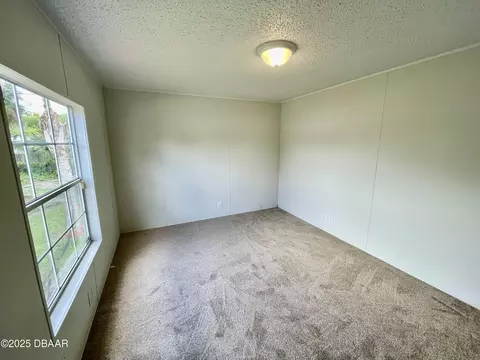 Bedroom - 1910 Woodcrest Dr, Ormond Beach, FL 32174 photo 5 of 6