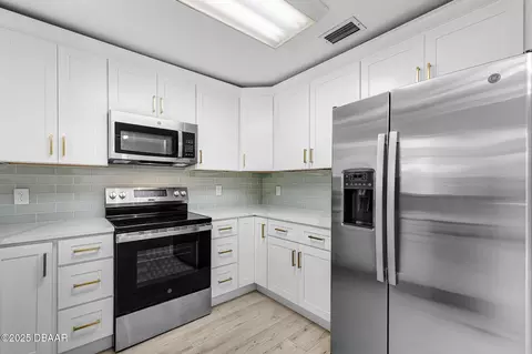 Kitchen - 2225 Pine Tree Dr, Edgewater, FL 32141 photo 3 of 5