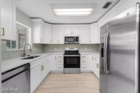 Kitchen - 2225 Pine Tree Dr, Edgewater, FL 32141 photo 1 of 5